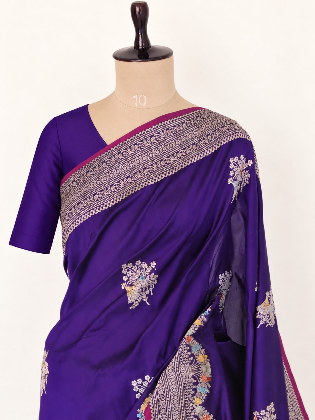 Rich royal purple with a contrasting magenta edge and multicoloured accents Katan Silk Banarasi saree front drape view