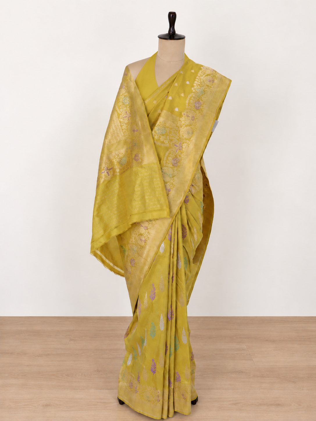 Mustard yellow with a subtle olive undertone, accented with lilac, mint green and light gold zari Katan Silk Banarasi saree pallu detail