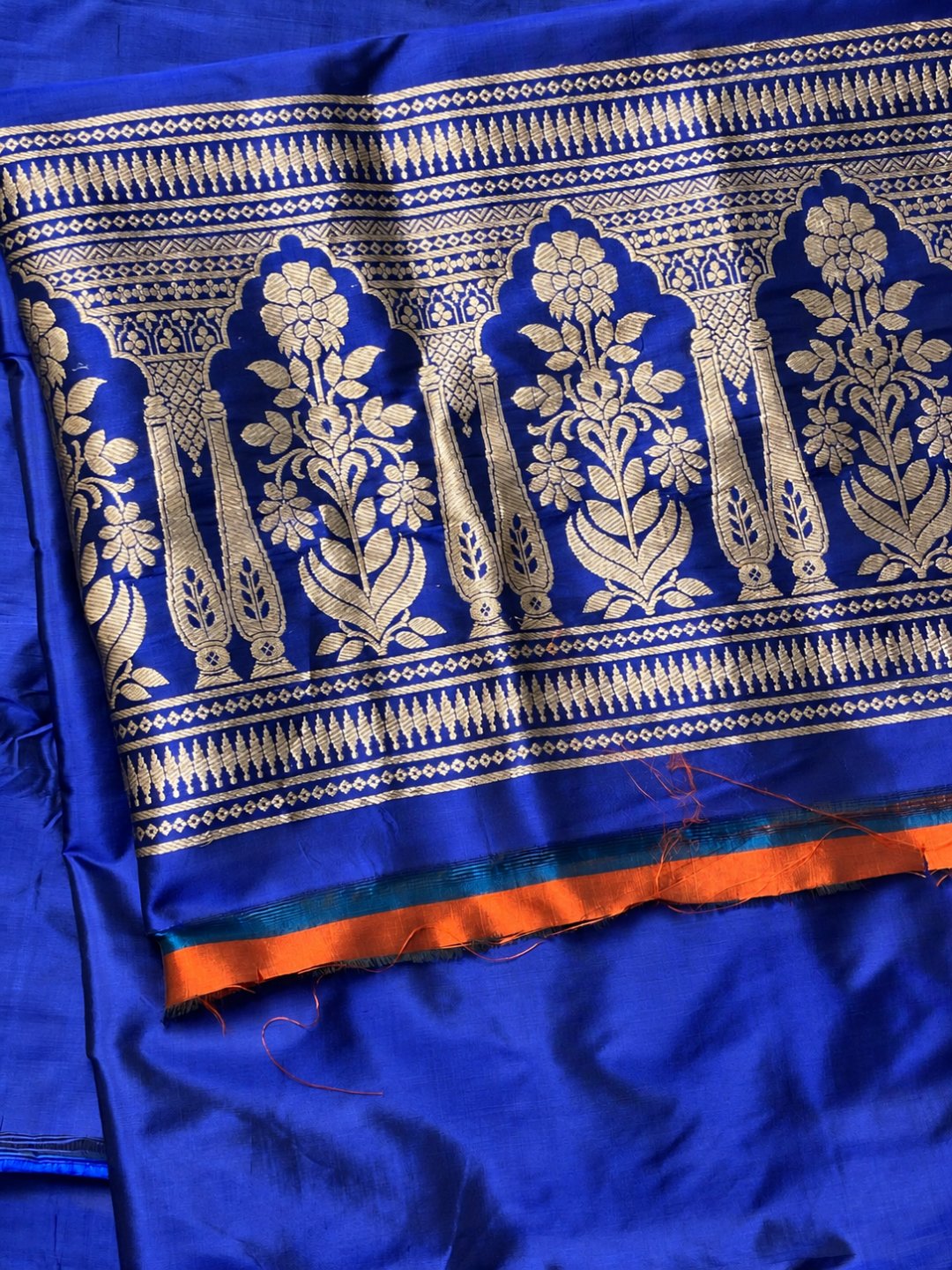 Royal blue with gold detailing and small red accents Katan Silk Banarasi suit dupatta detail