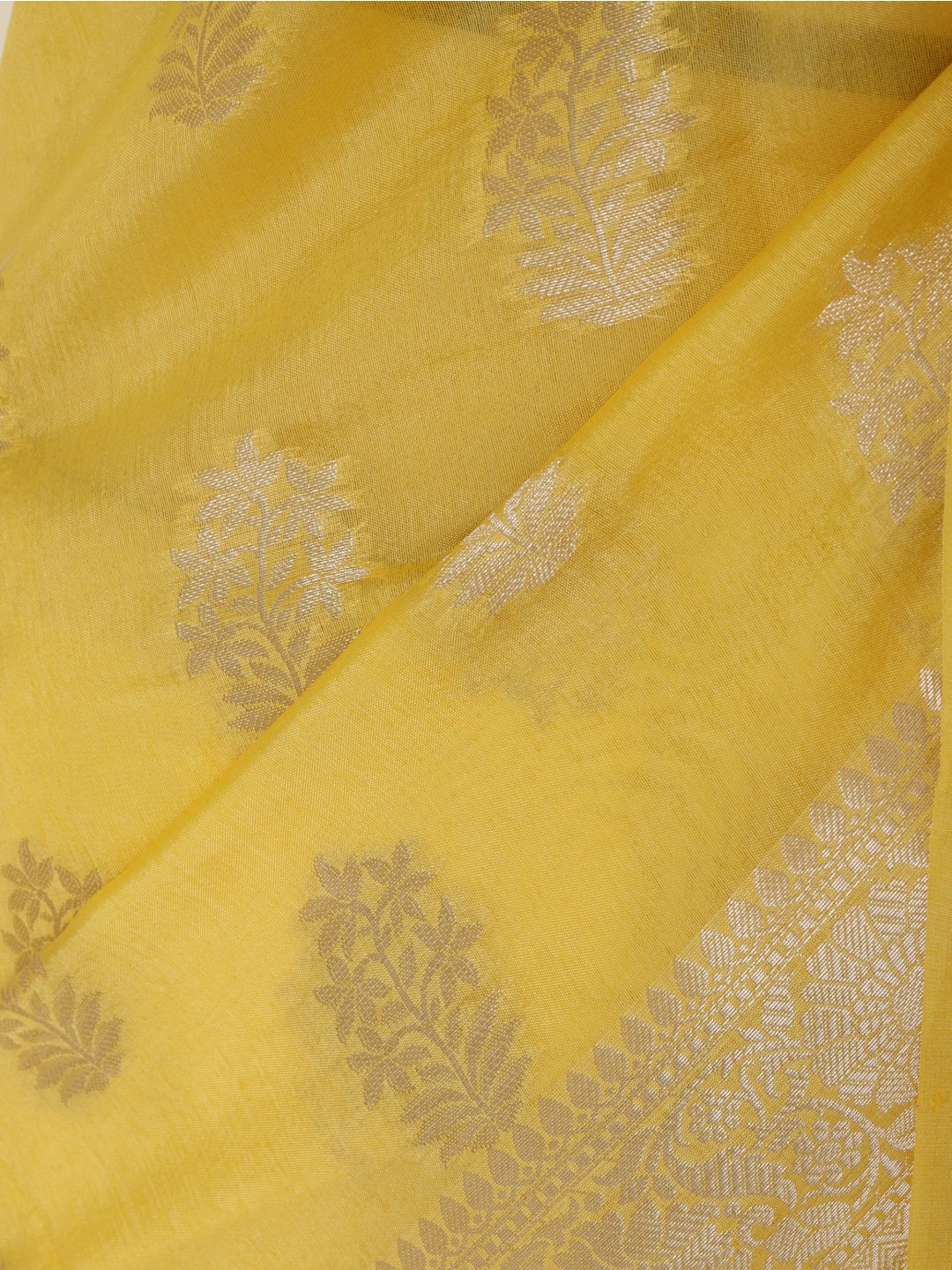 Bright lemon yellow with light gold-toned detailing Viscose saree Banarasi saree pallu detail