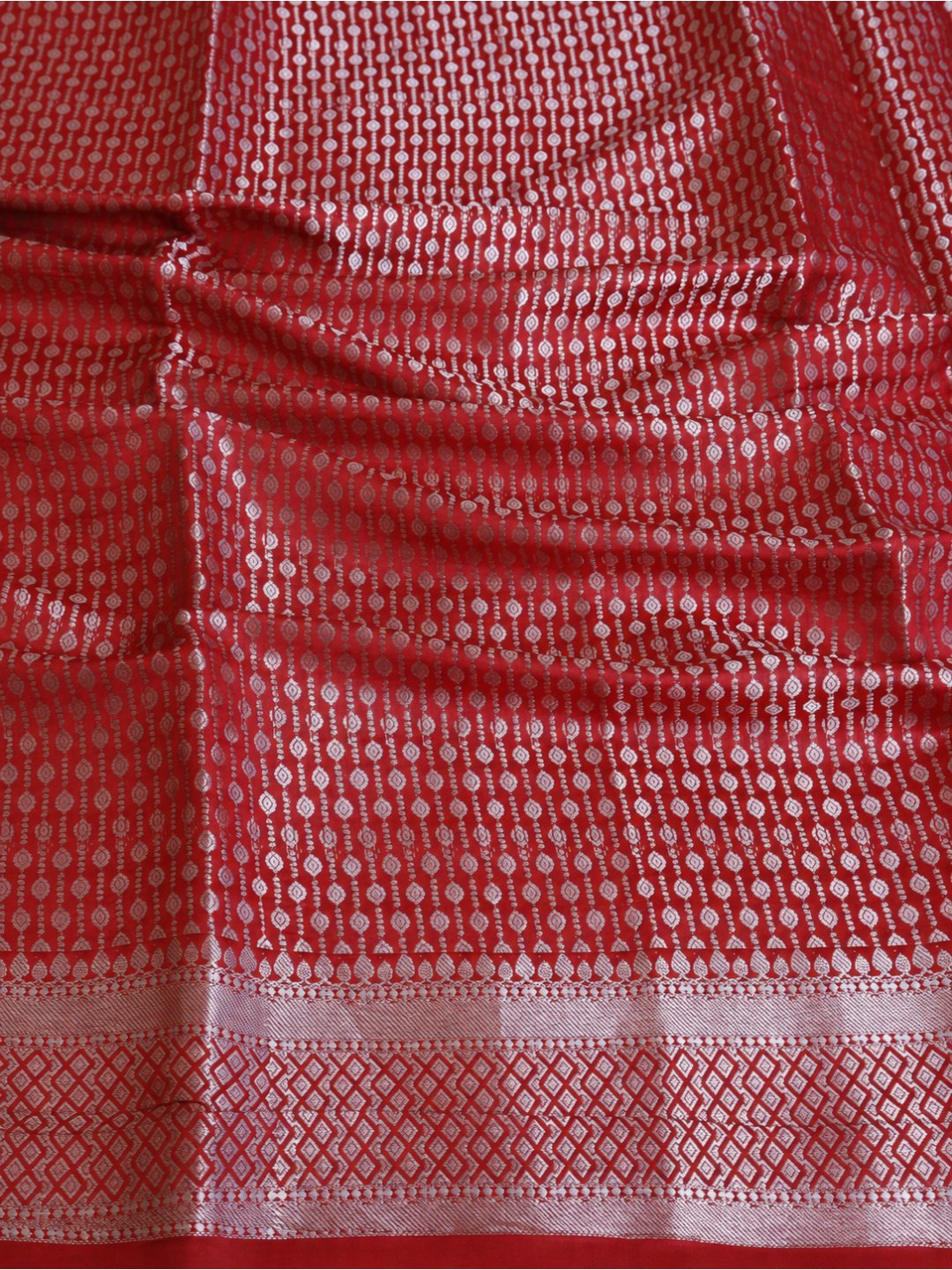 Bright red with silver-toned detailing Chiniya Silk Banarasi saree zari work detail