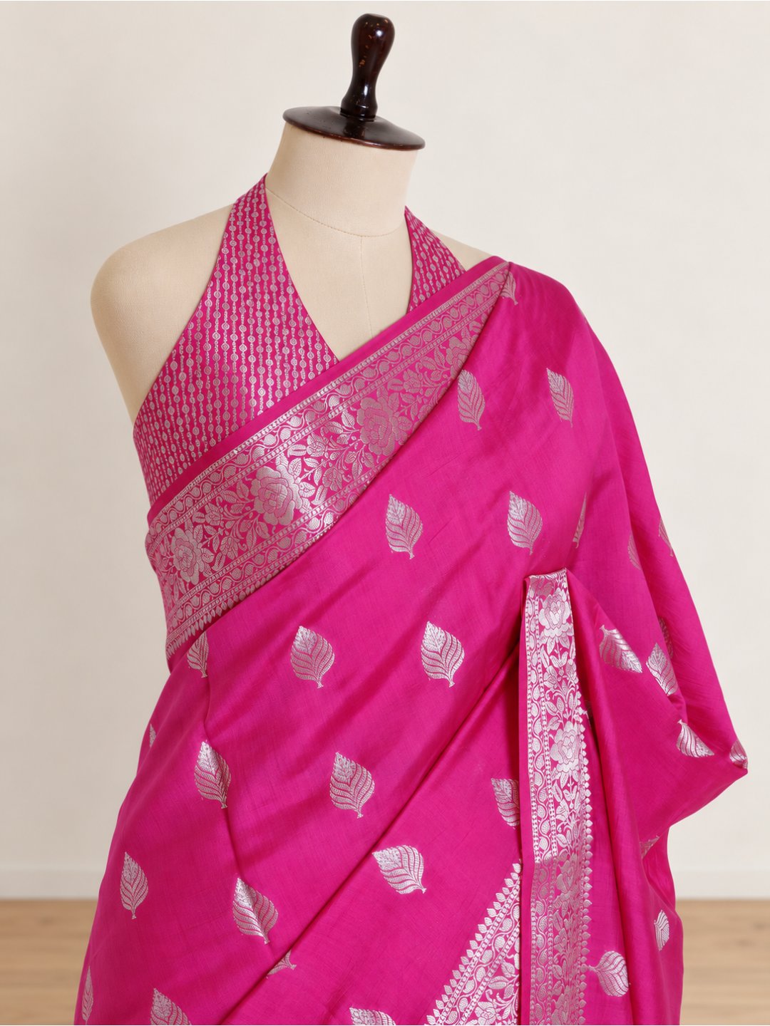 Rani pink with silver-toned detailing Chiniya Silk Banarasi saree folded view