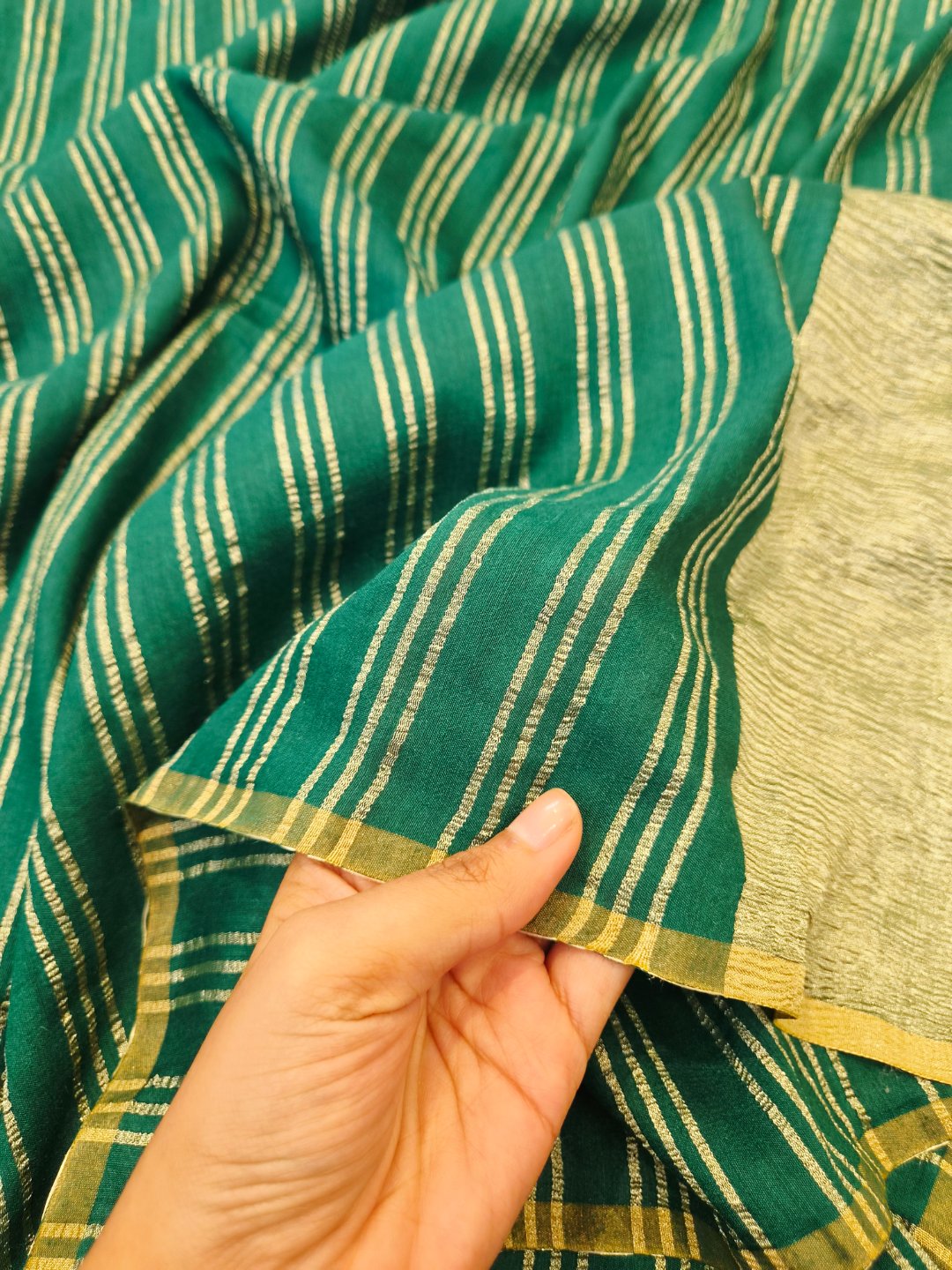 Bottle Green Moonga Silk Banarasi saree border closeup