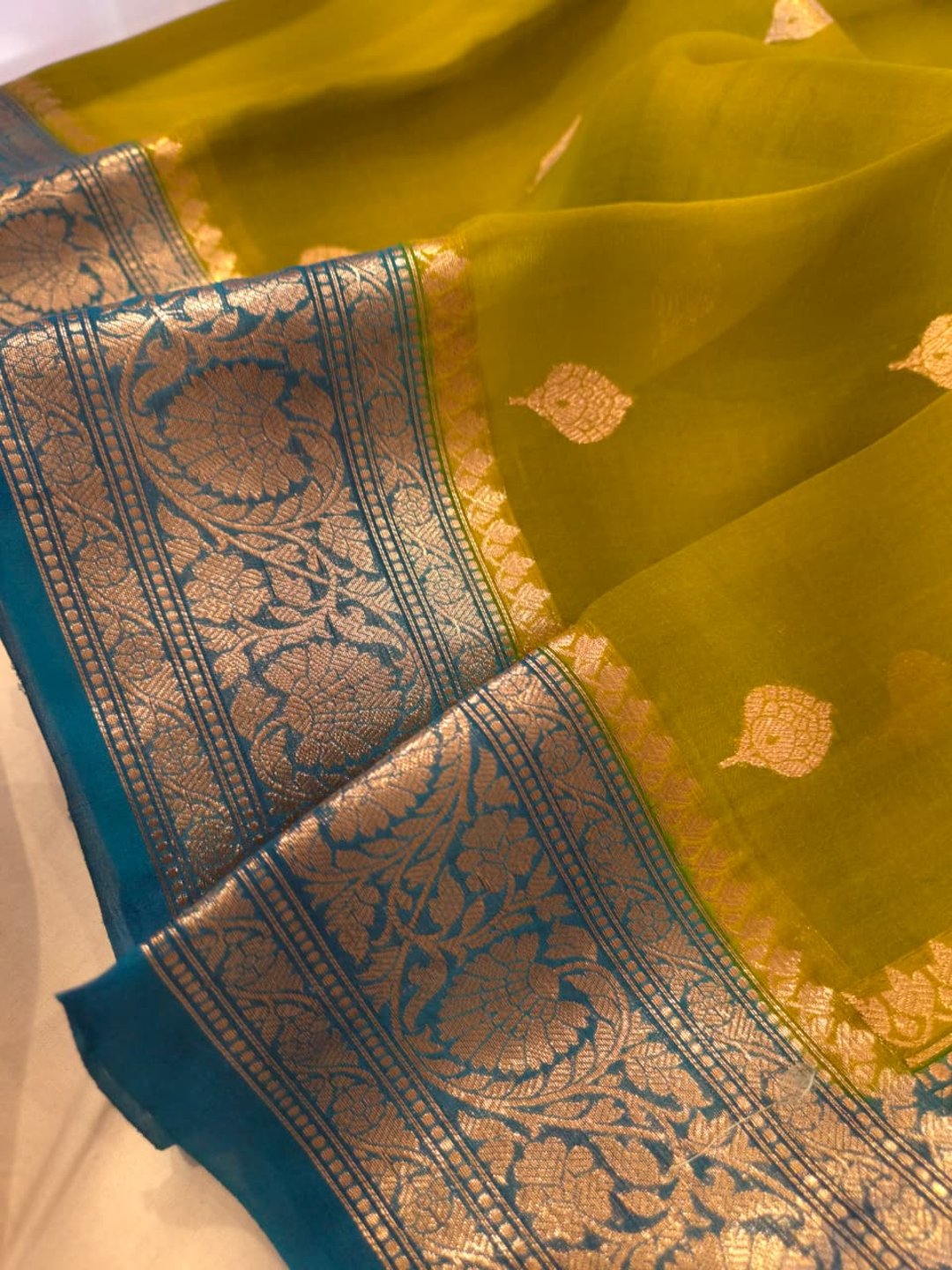 Olive green body with peacock blue border Kora Silk Banarasi saree pallu detail