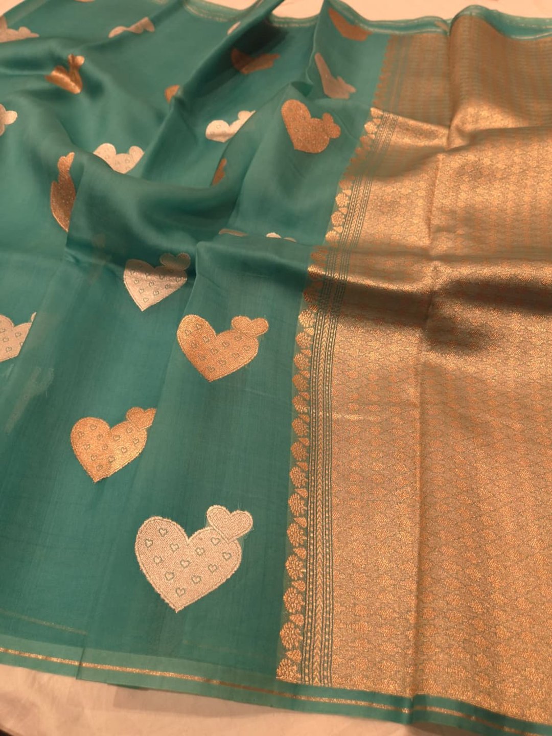 Teal blue Kora Silk Banarasi saree front drape view