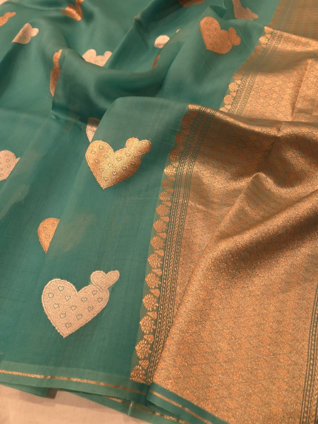 Teal blue Kora Silk Banarasi saree pallu detail