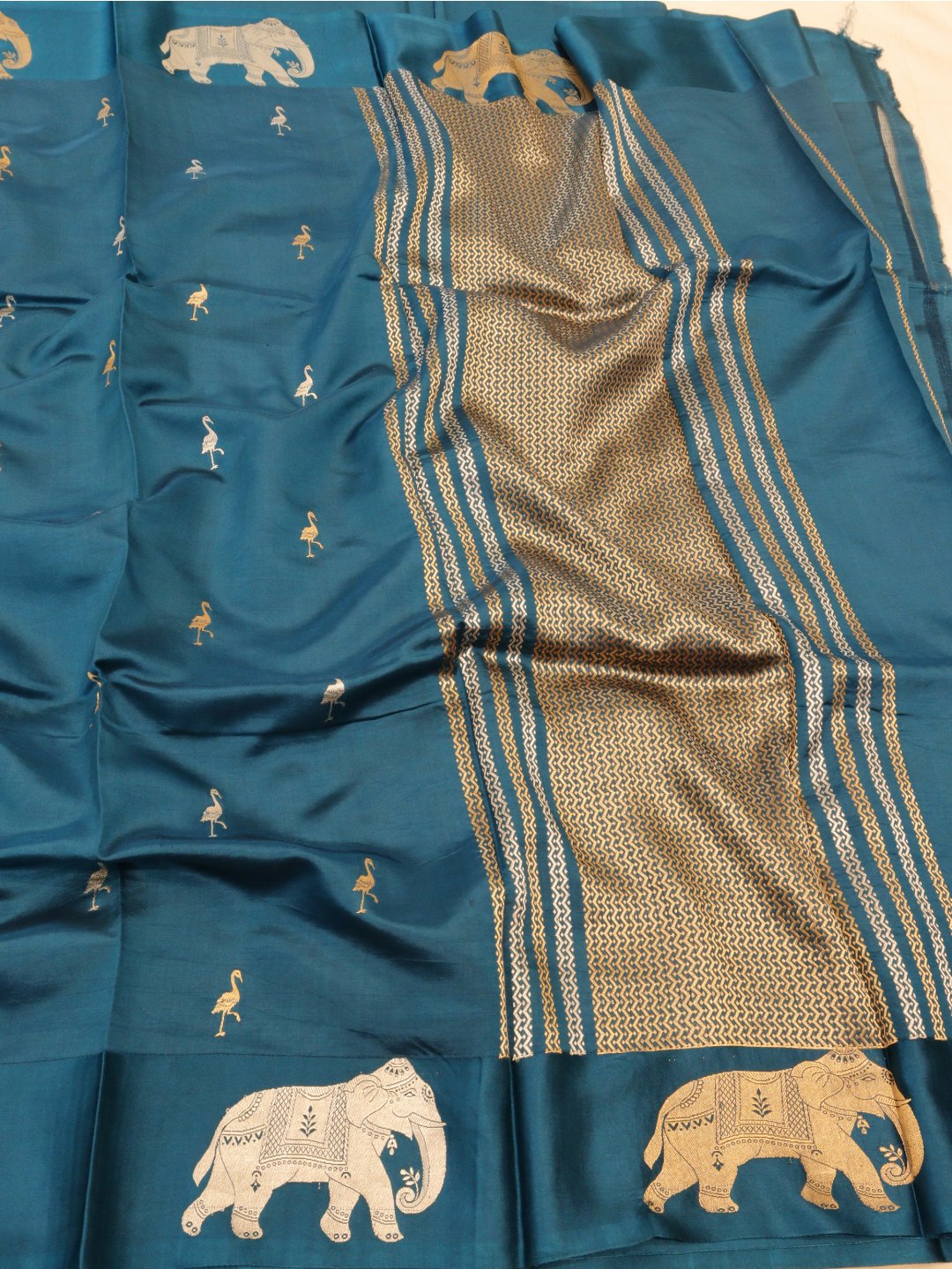 Deep teal blue with gold and silver-toned zari Katan Silk Banarasi saree front drape view