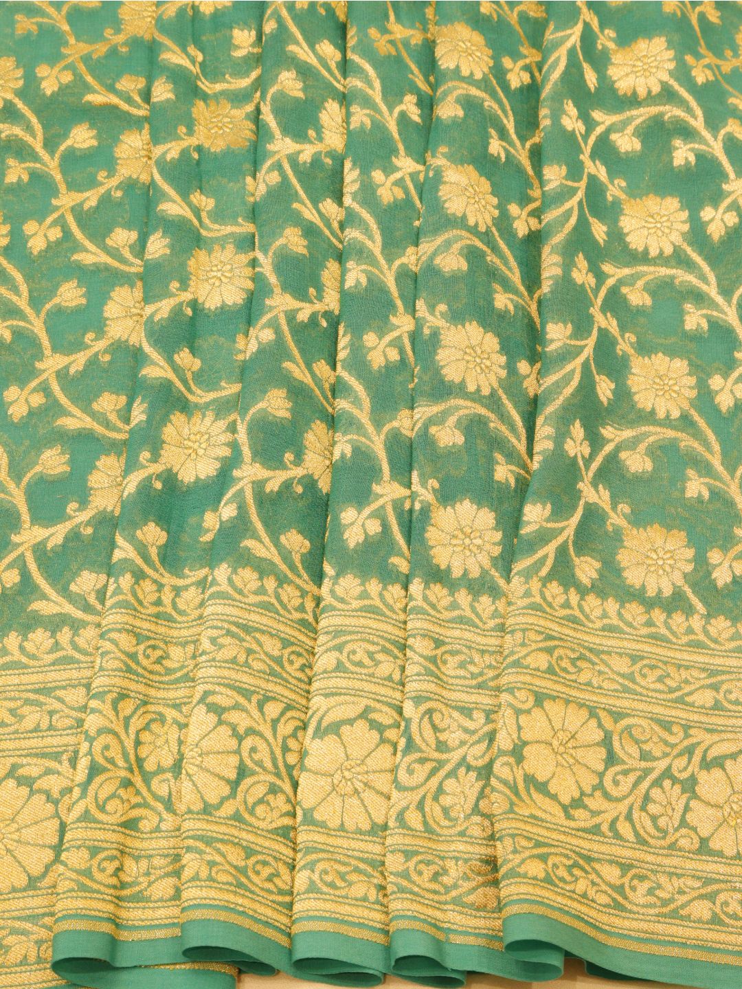 Sea Green with silver zari detailing Khaddi Georgette Banarasi saree border closeup