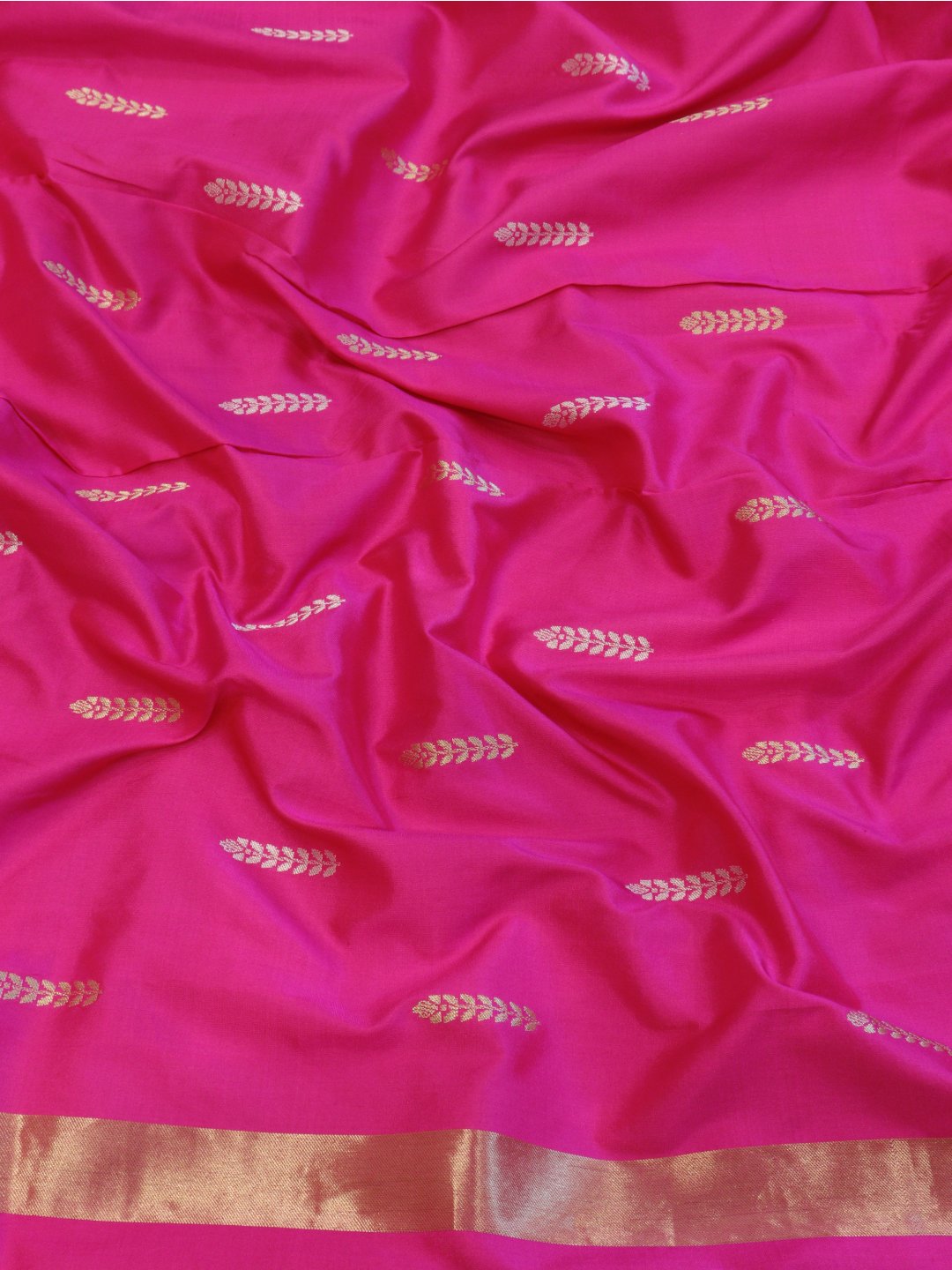 Red with a contrasting rani pink edge and gold-toned zari Katan Silk Banarasi saree texture detail