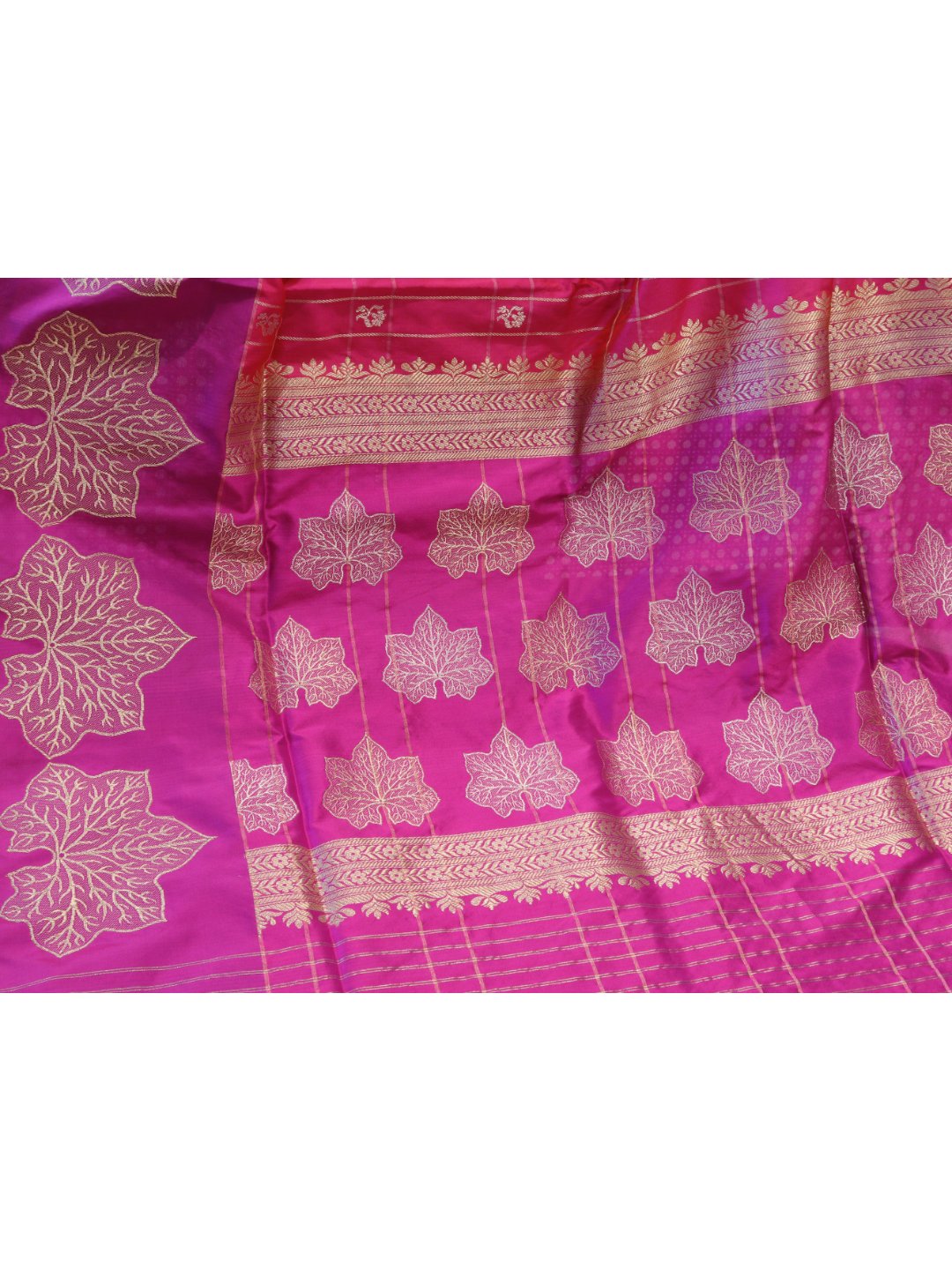 Rani pink with a contrasting purple border and pallu. Katan Silk Banarasi saree full spread