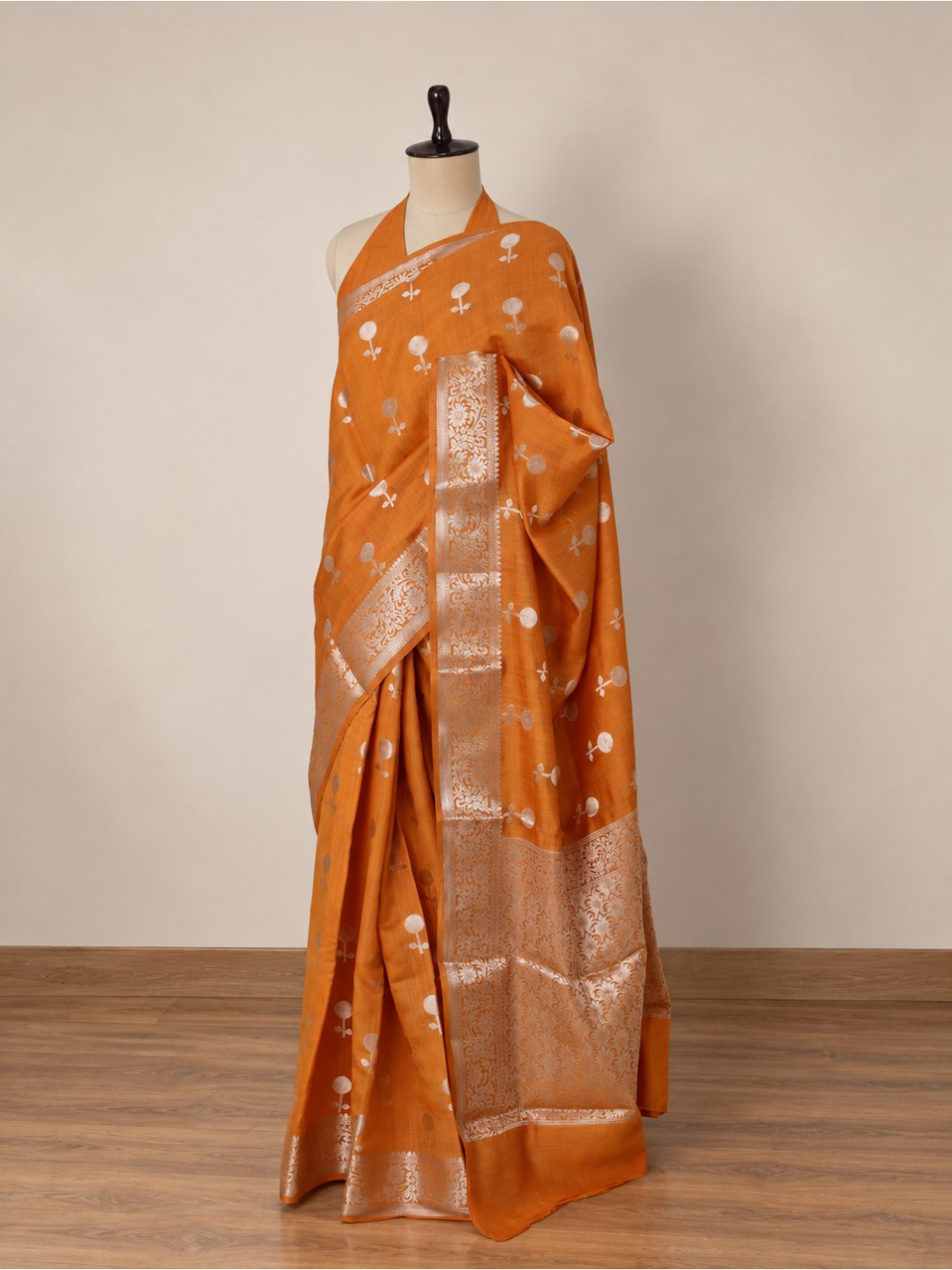 Orange with silver-toned zari detailing Chiniya Silk Banarasi saree border closeup