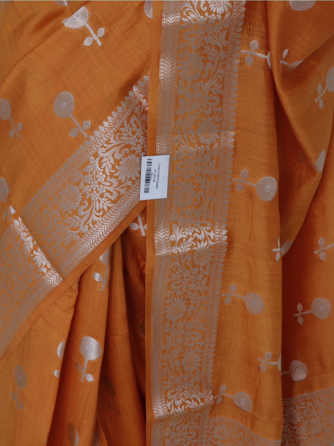 Orange with silver-toned zari detailing Chiniya Silk Banarasi saree texture detail