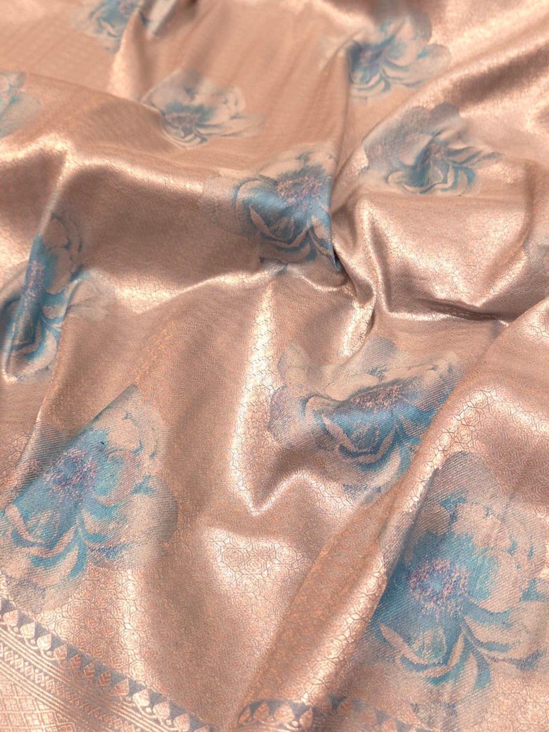 Silver body with sky blue floral motifs Mulbari silk Banarasi saree border closeup
