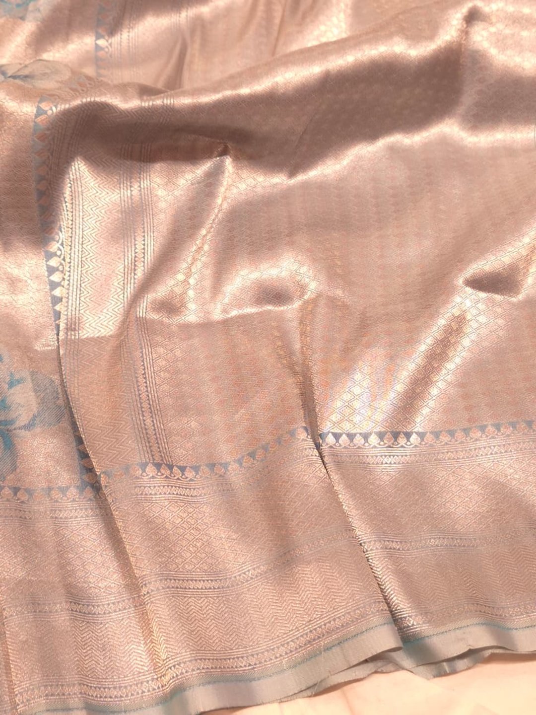 Silver body with sky blue floral motifs Mulbari silk Banarasi saree texture detail