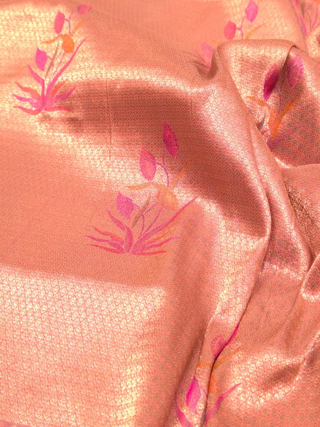 A soft peach and rose-gold base with pink, purple, orange accents Mulbari silk Banarasi saree blouse piece