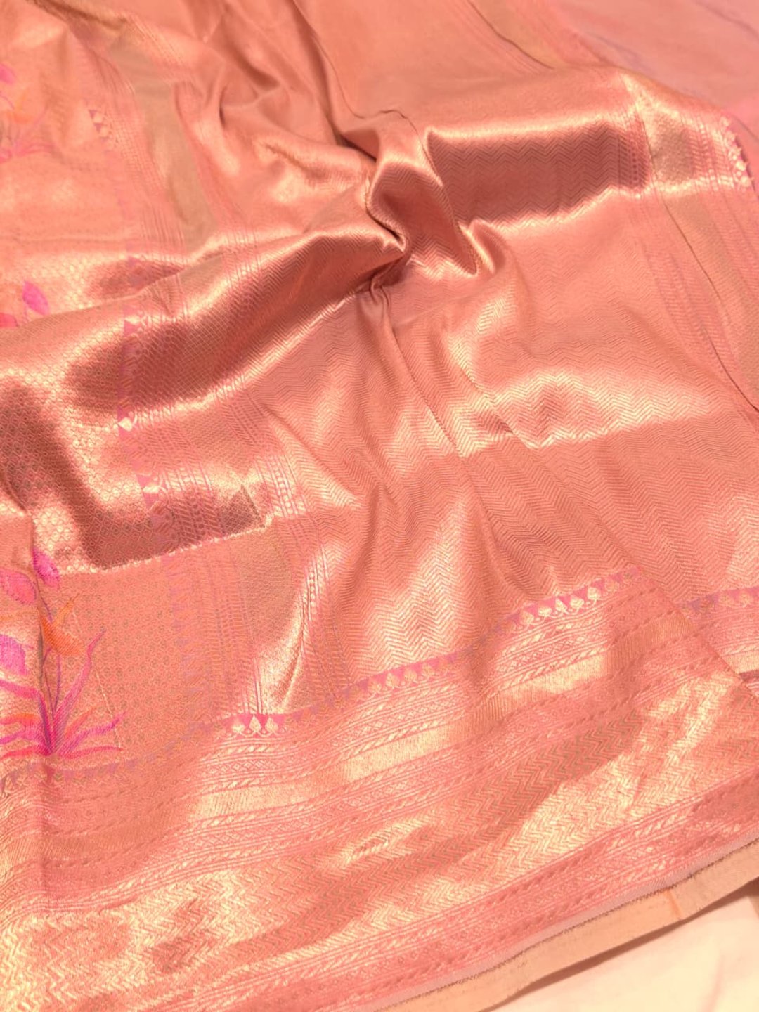 A soft peach and rose-gold base with pink, purple, orange accents Mulbari silk Banarasi saree zari work detail