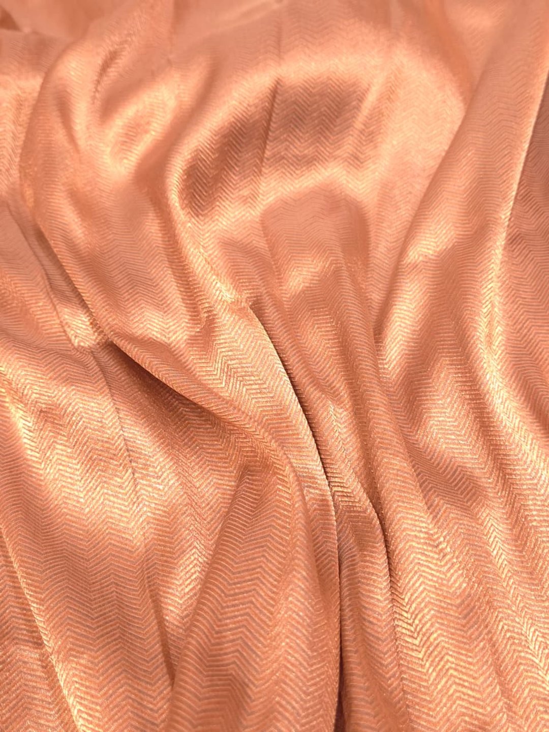 A soft peach and rose-gold base with pink, purple, orange accents Mulbari silk Banarasi saree folded view