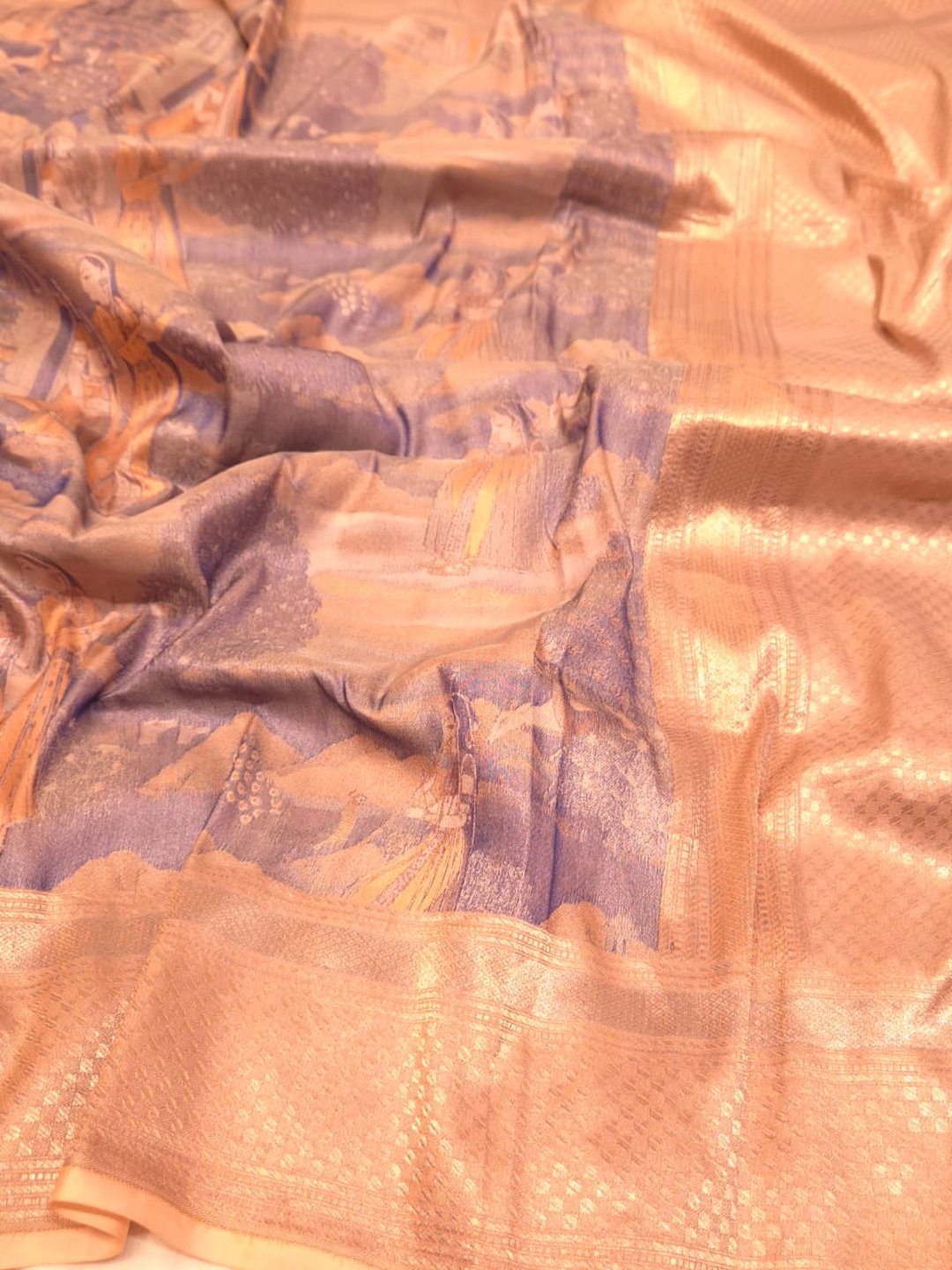 A muted lavender-grey base with peach, orange and gold-toned Mulbari Silk Banarasi saree front drape view