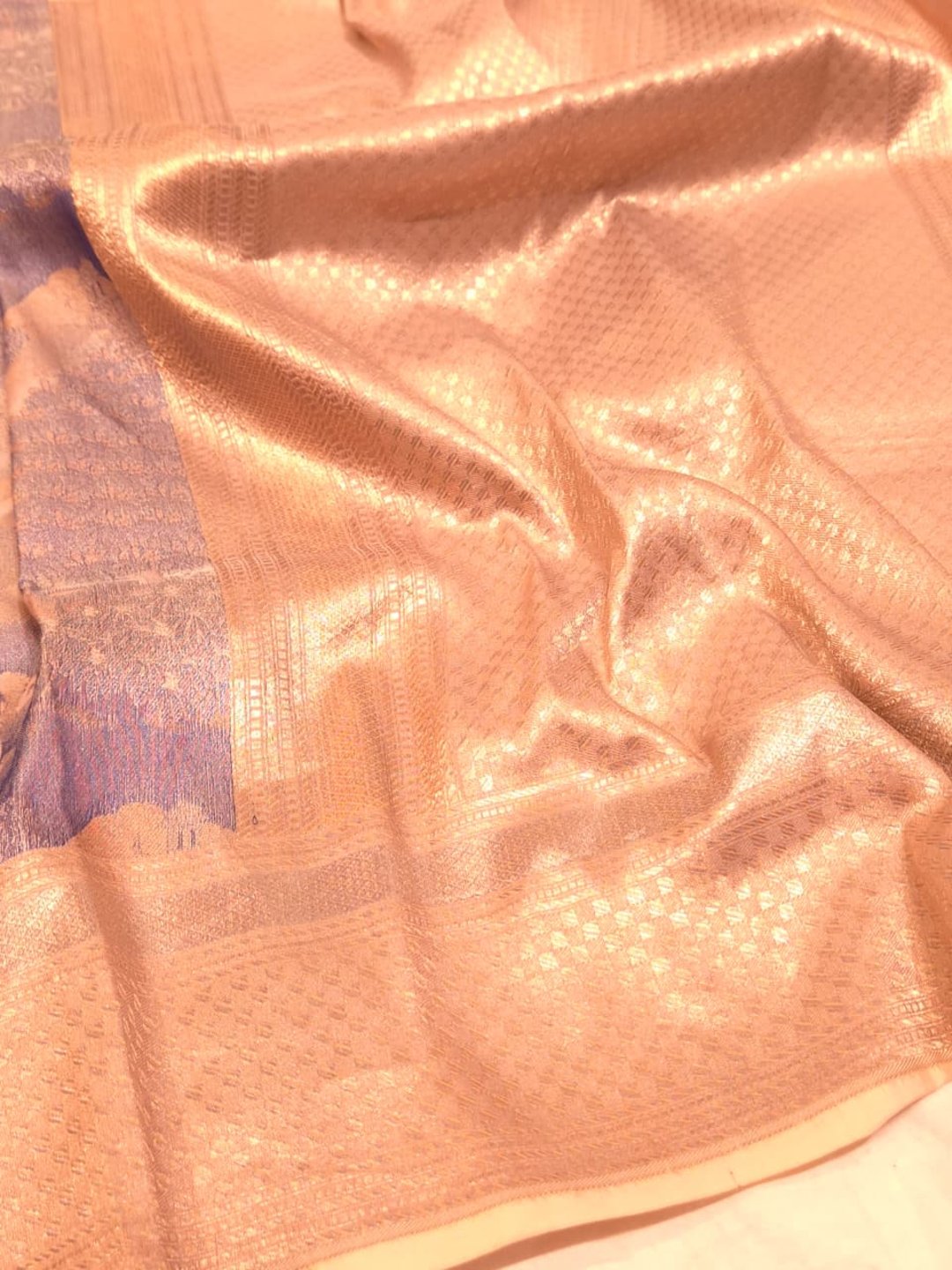 A muted lavender-grey base with peach, orange and gold-toned Mulbari Silk Banarasi saree full spread