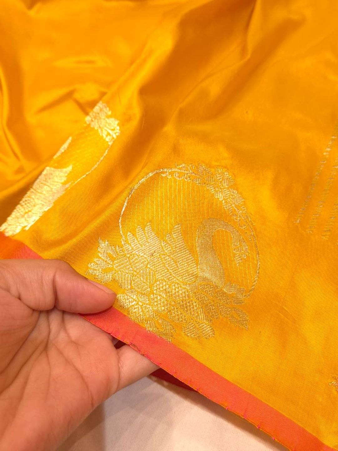 Yellow with Golden bird pattern border Katan Silk Banarasi saree border closeup
