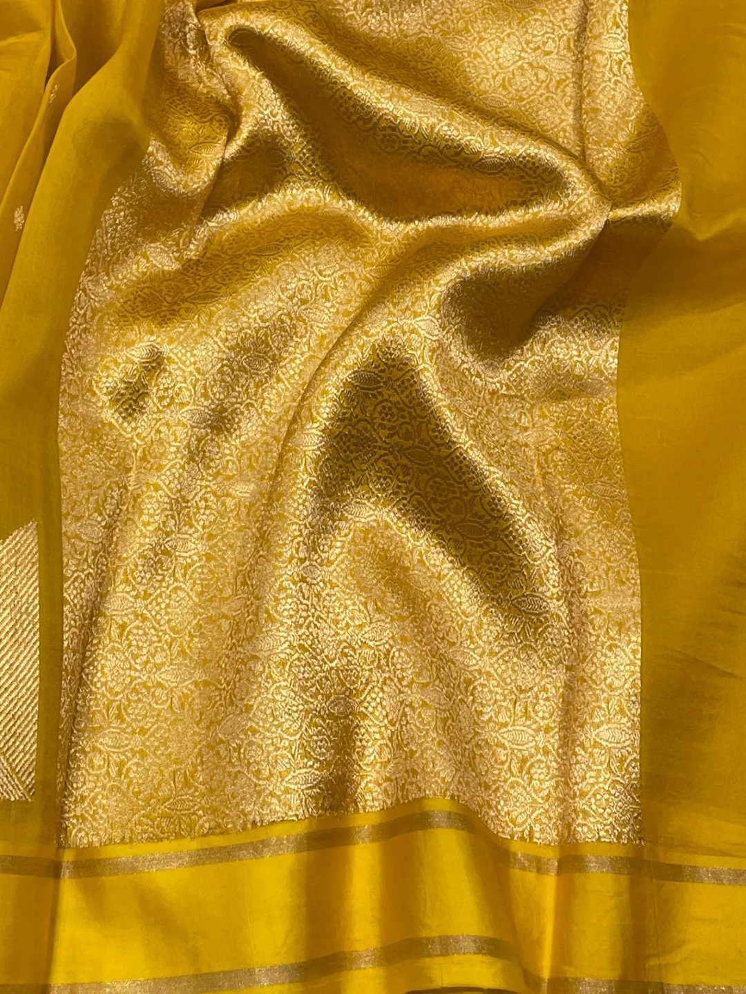Dark yellow Kora Silk Banarasi saree border closeup