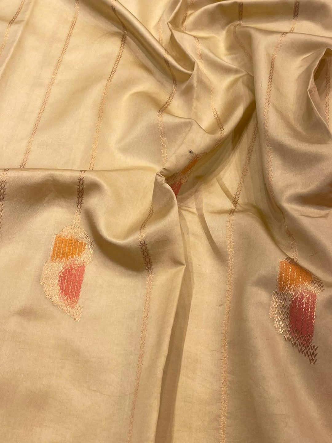Ivory with Orange and Pink shade Katan Silk Banarasi saree border closeup