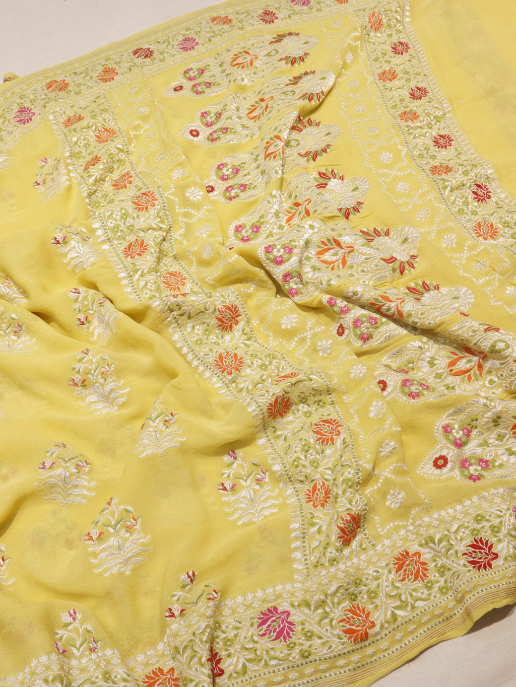 Yellow Khaddi Georgette Banarasi saree border closeup – Hikayat Banaras
