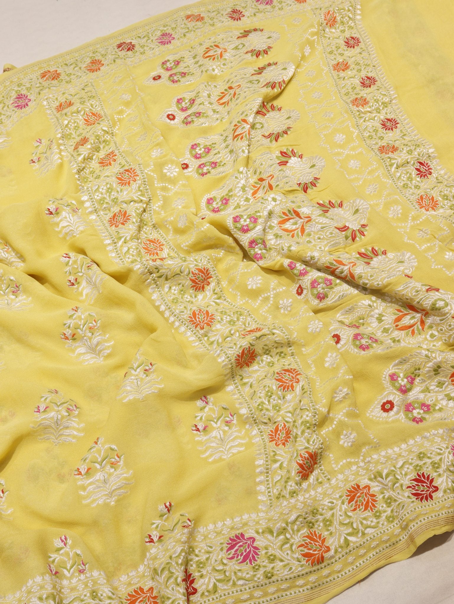 Yellow Khaddi Georgette Banarasi saree border closeup – Hikayat Banaras