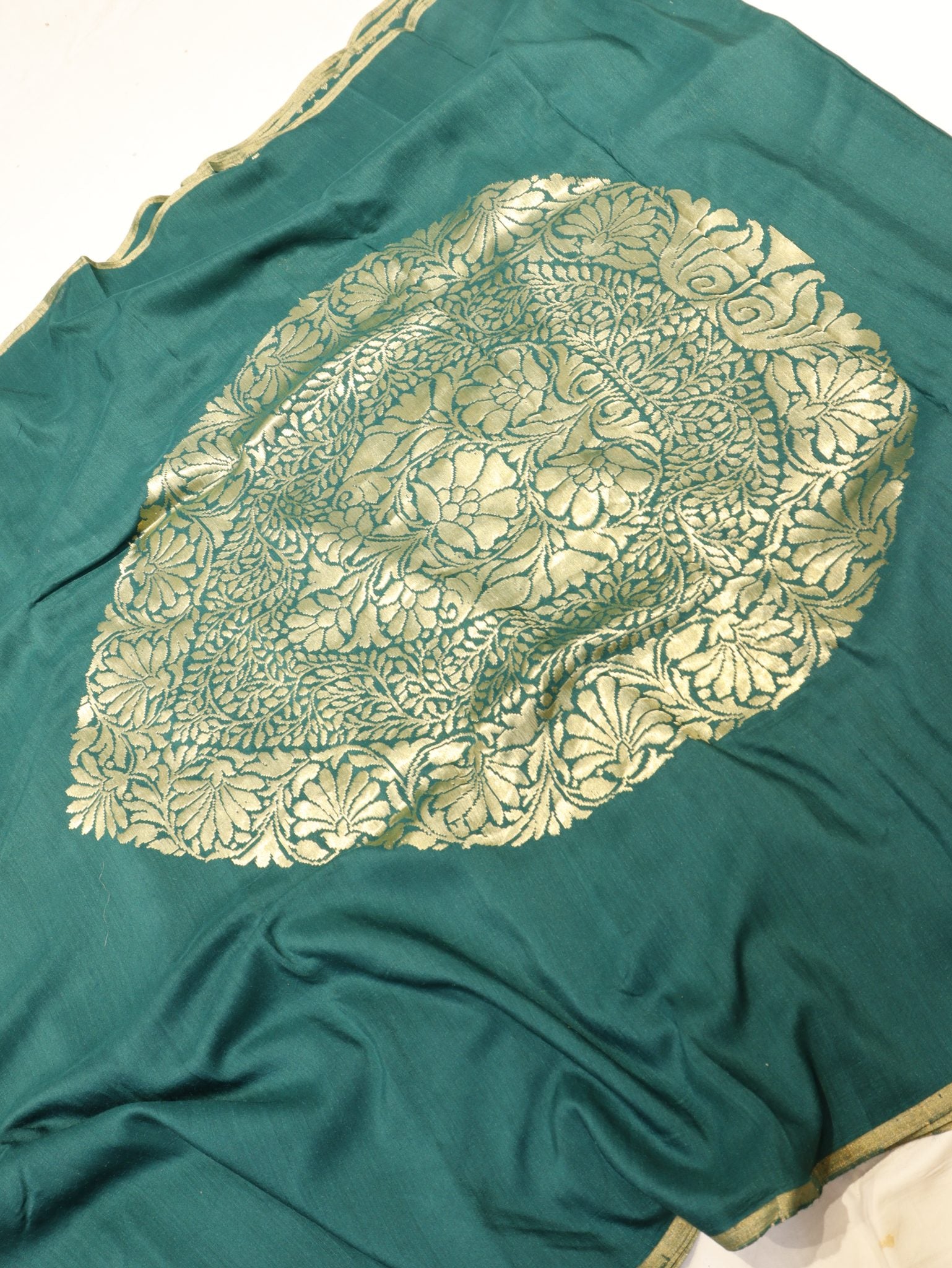 Bottle Green Moonga Silk Banarasi saree folded view