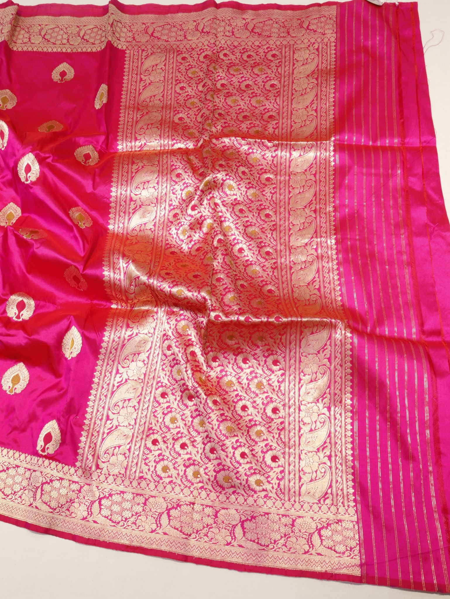Rani Pink Katan Silk Banarasi saree folded view