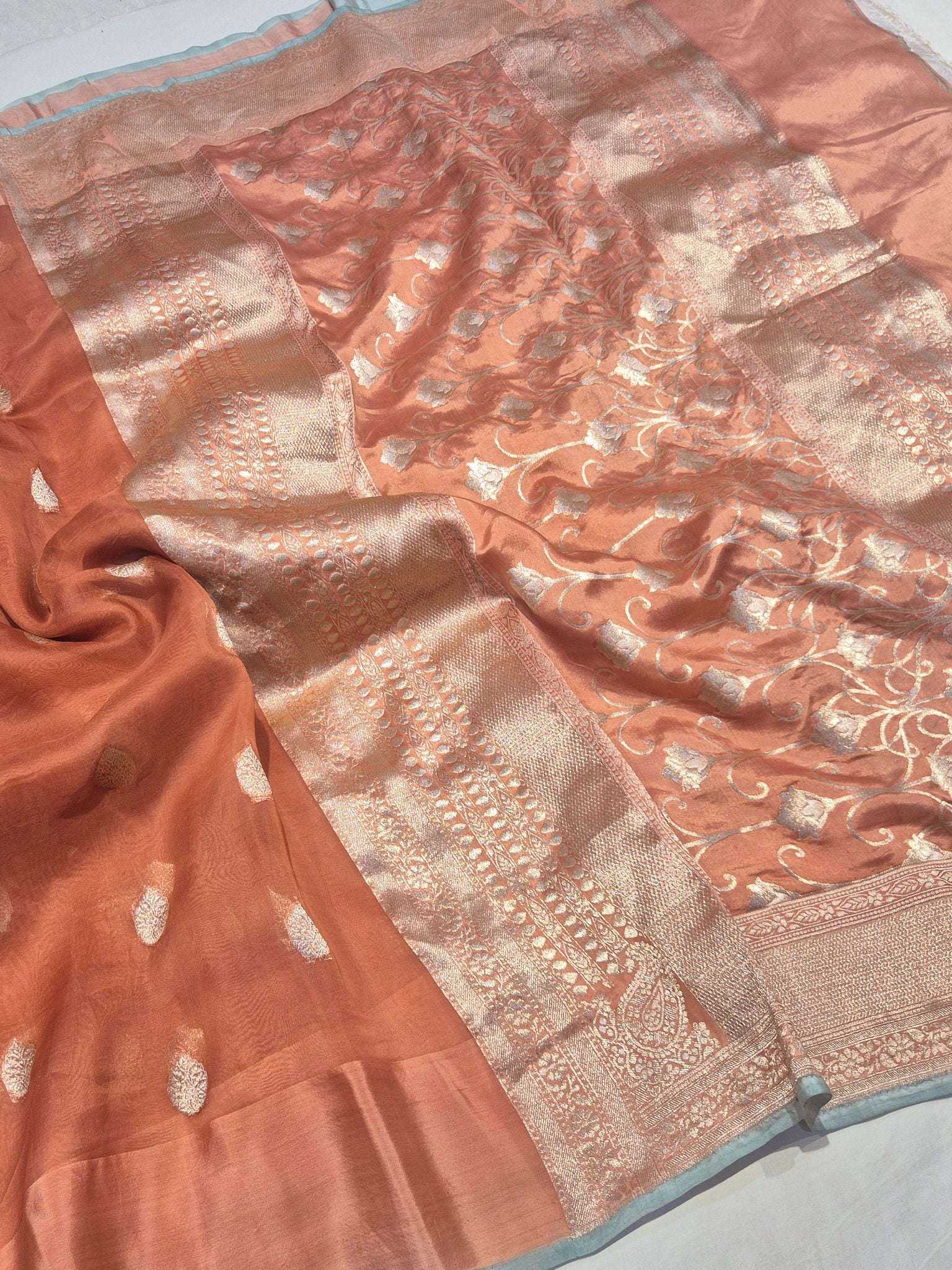 Warm Rust Peach Kora Silk Banarasi saree border closeup