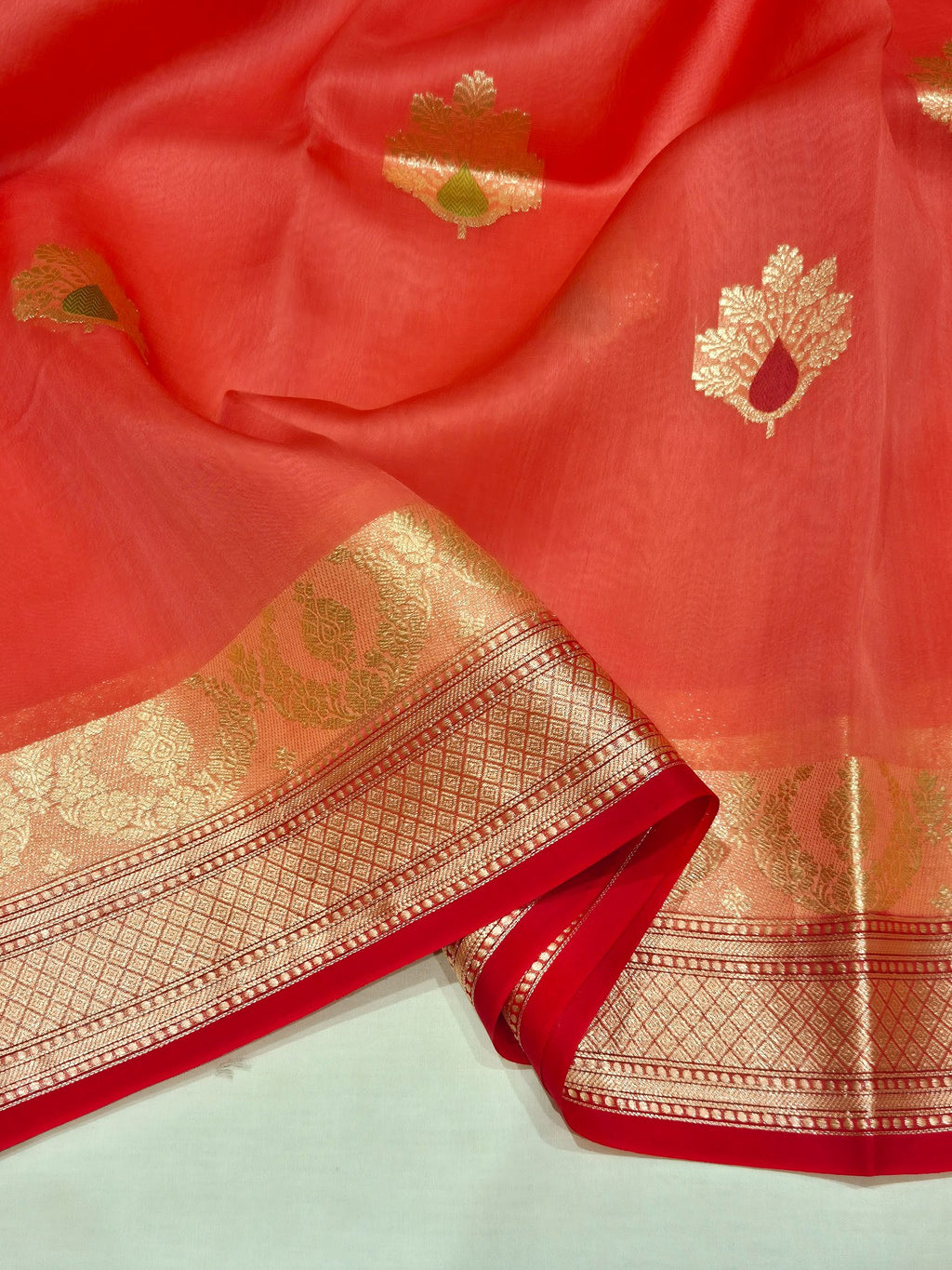 Hot Coral Kora Silk Banarasi saree border closeup