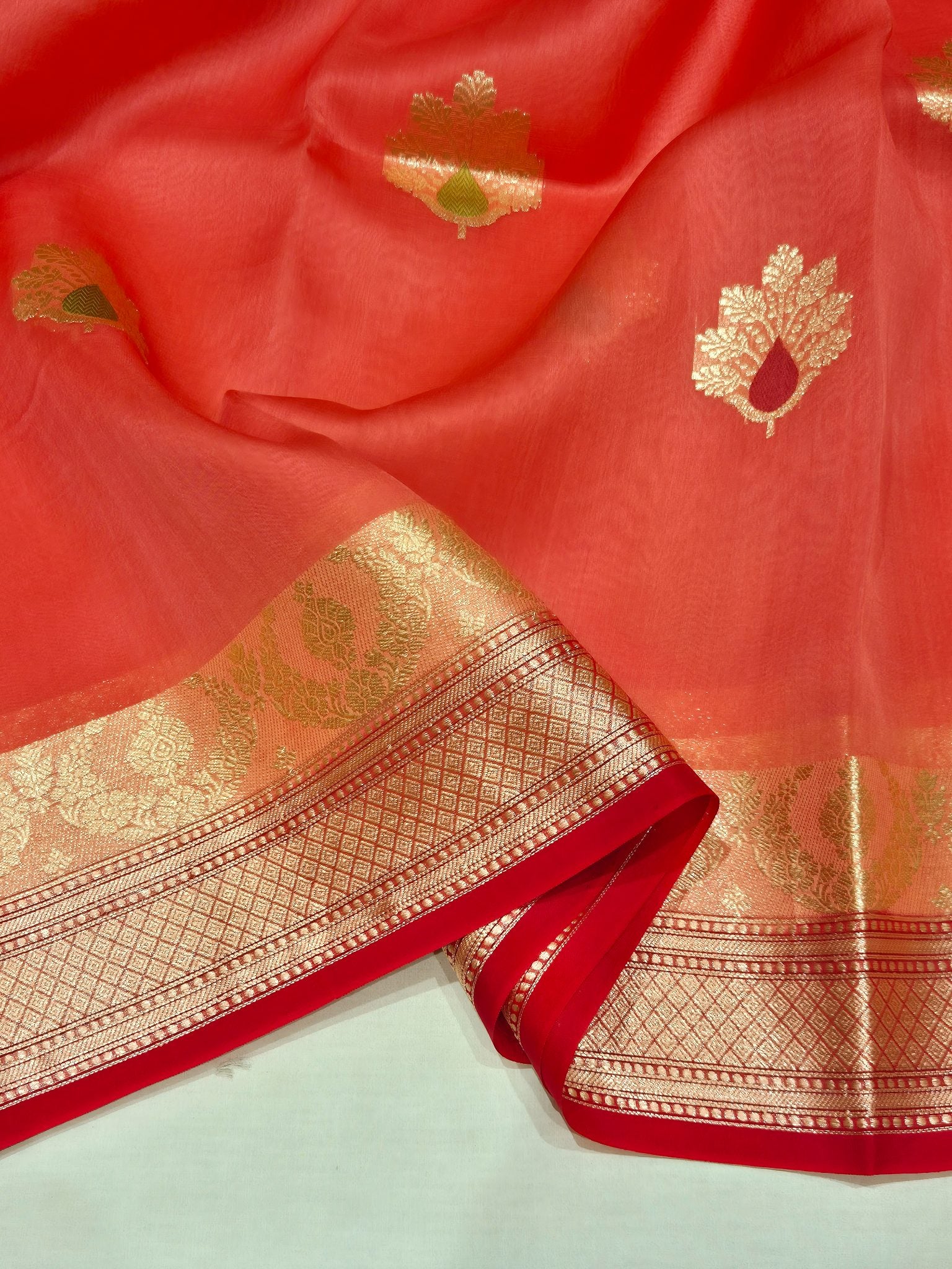 Hot Coral Kora Silk Banarasi saree border closeup