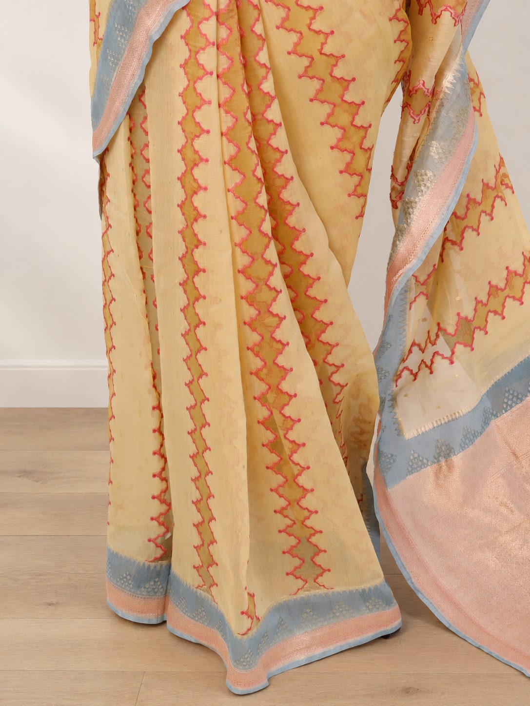 Pastel lemon yellow Kora Silk Banarasi saree border closeup
