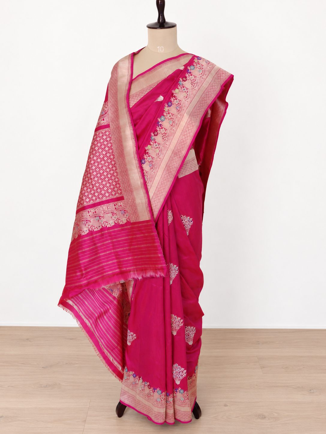 Rich rani pink with zari detailing and multicoloured Meenakari accents Katan Silk Banarasi saree pallu detail