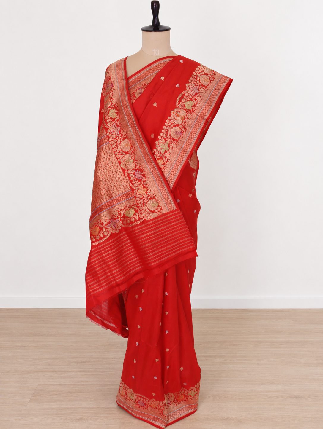 Vibrant vermilion red with gold-toned zari and purple, green and orange accents Katan Silk Banarasi saree front drape view
