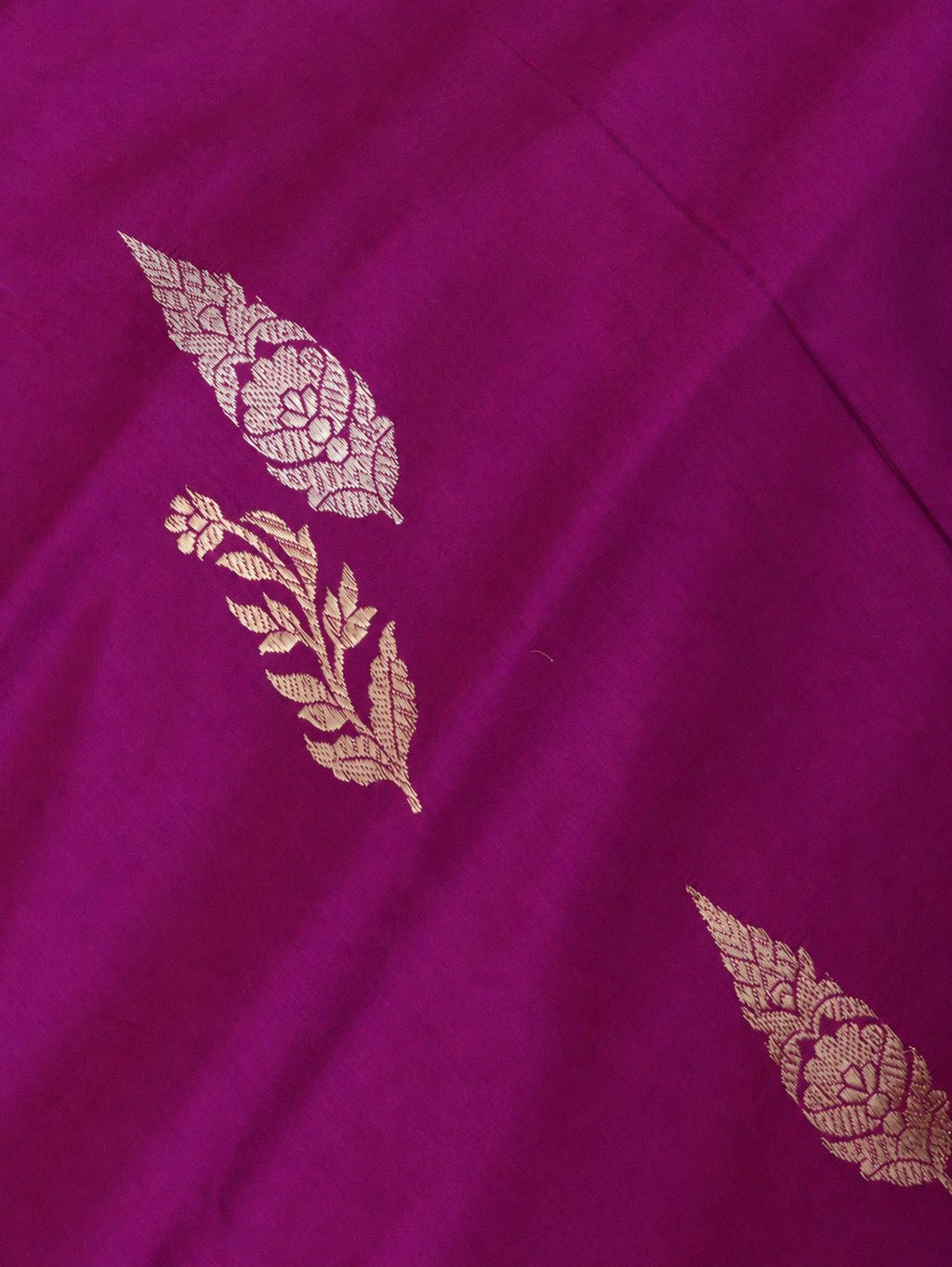 Rich purple-magenta with gold and silver-toned zari and subtle multicoloured accents Katan Silk Banarasi saree border closeup