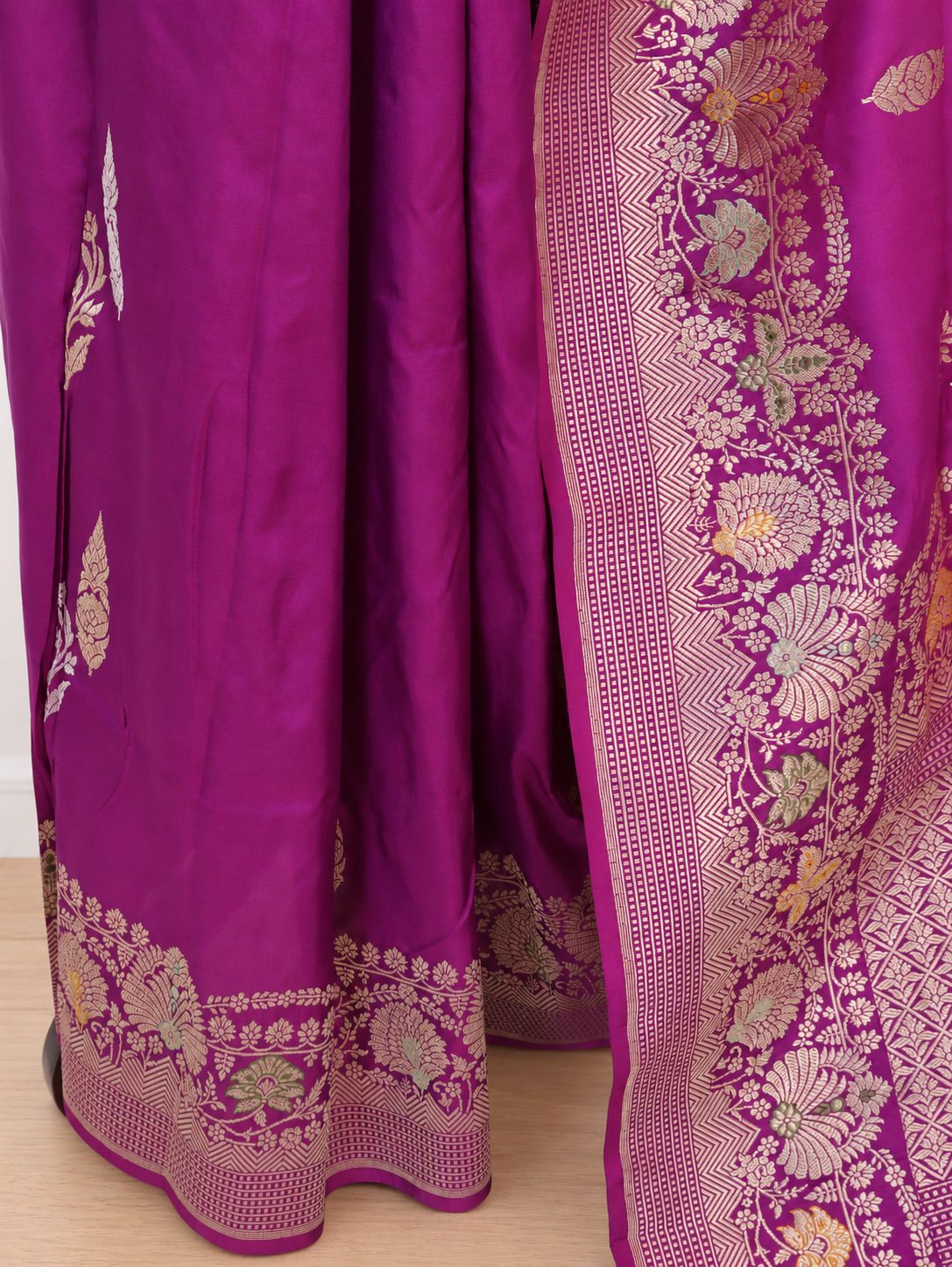 Rich purple-magenta with gold and silver-toned zari and subtle multicoloured accents Katan Silk Banarasi saree pallu detail