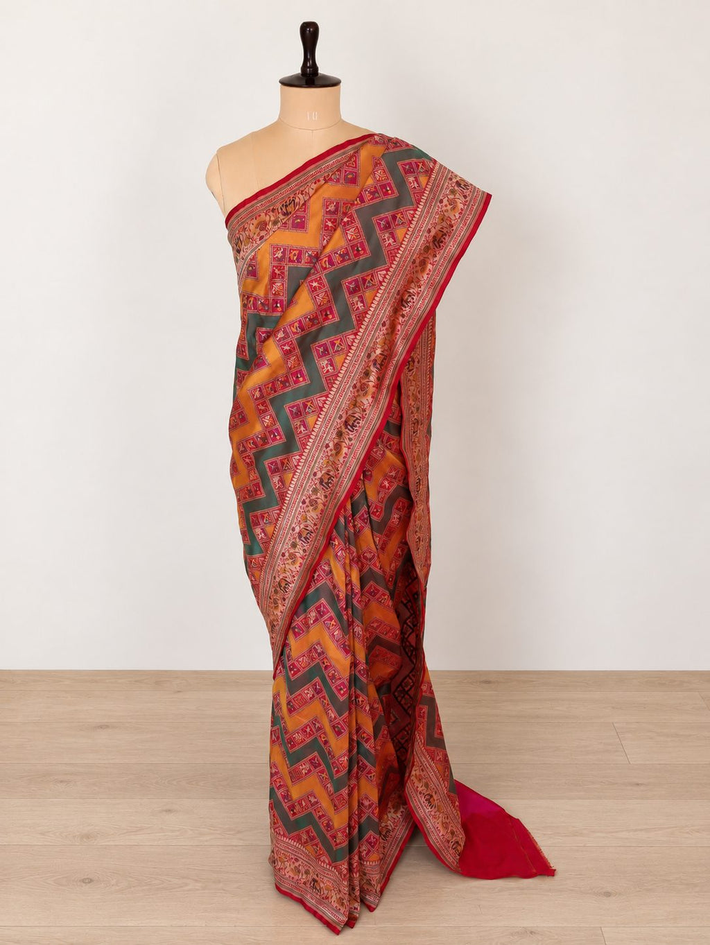 Mustard yellow and deep green, accented with rani pink, red edging and gold toned zari Katan Silk Banarasi saree front drape view