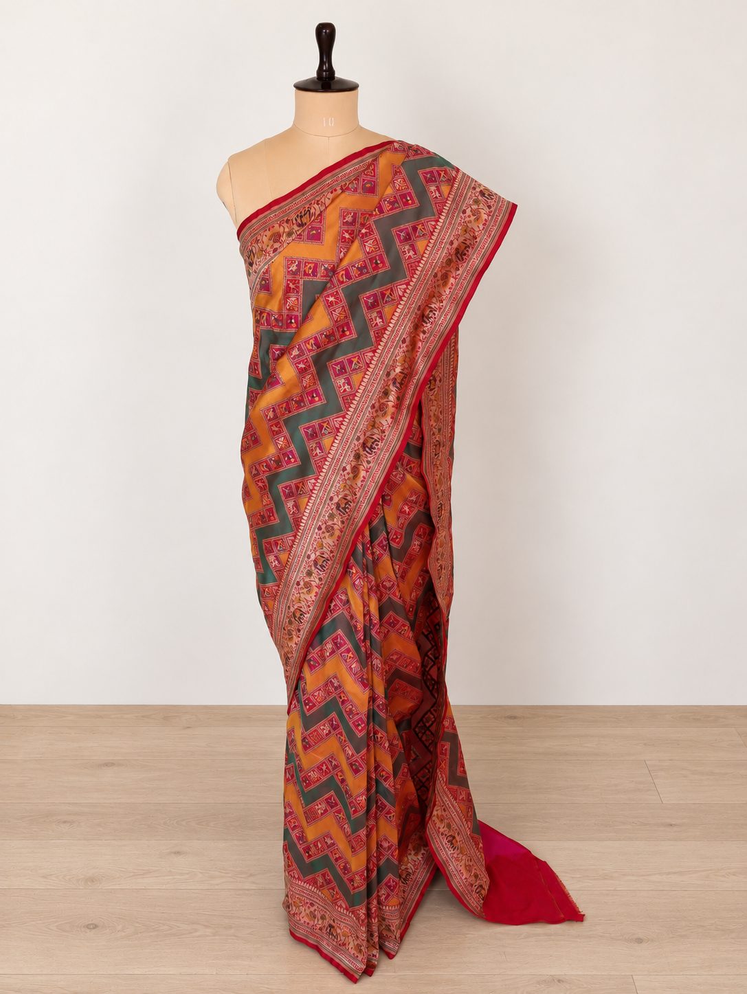 Mustard yellow and deep green, accented with rani pink, red edging and gold toned zari Katan Silk Banarasi saree front drape view