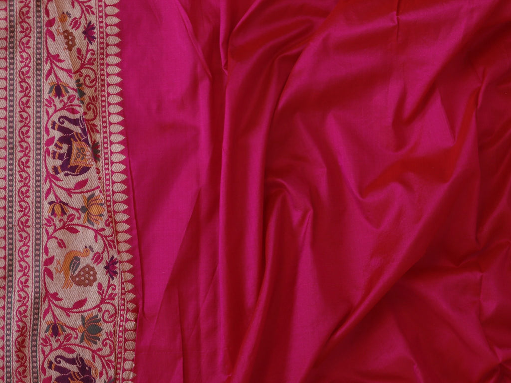 Mustard yellow and deep green, accented with rani pink, red edging and gold toned zari Katan Silk Banarasi saree front drape view