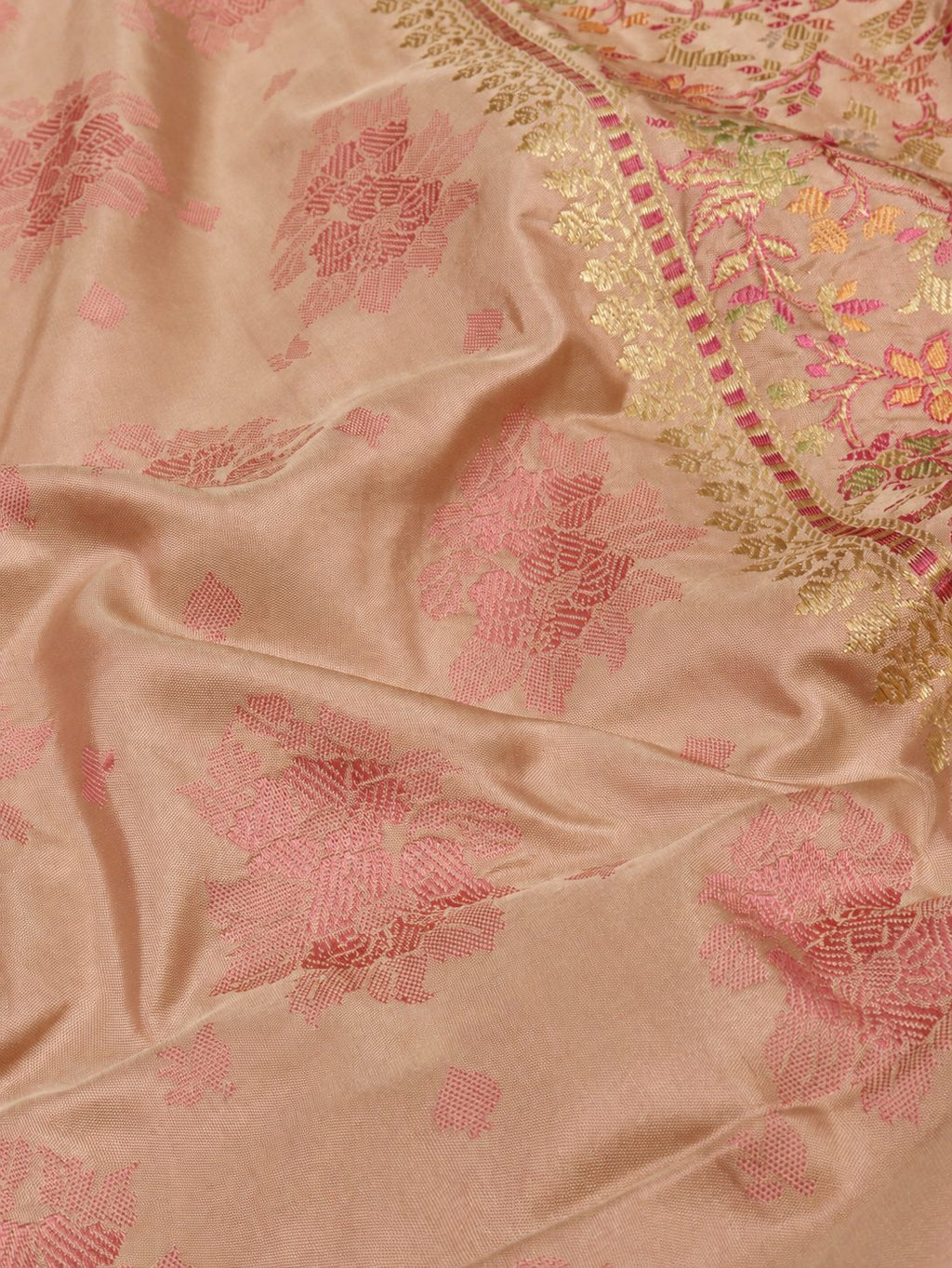 Soft champagne-beige body with rose-pink borders and pallu, accented with gold and silver-toned zari Katan Silk Banarasi saree border closeup