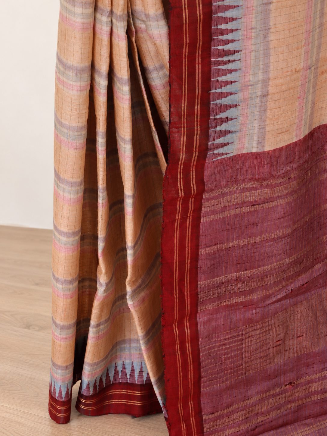 Soft peach-beige with pastel pink and powder-blue accents, contrasted by a deep maroon border Raw Silk Banarasi saree border closeup