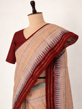Soft peach-beige with pastel pink and powder-blue accents, contrasted by a deep maroon border Raw Silk Banarasi saree front drape view