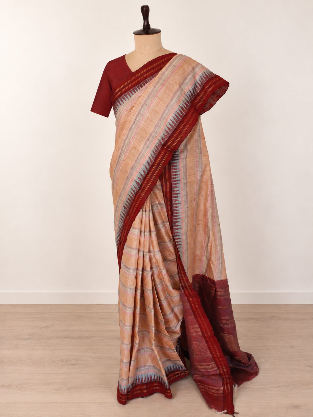 Soft peach-beige with pastel pink and powder-blue accents, contrasted by a deep maroon border Raw Silk Banarasi saree pallu detail