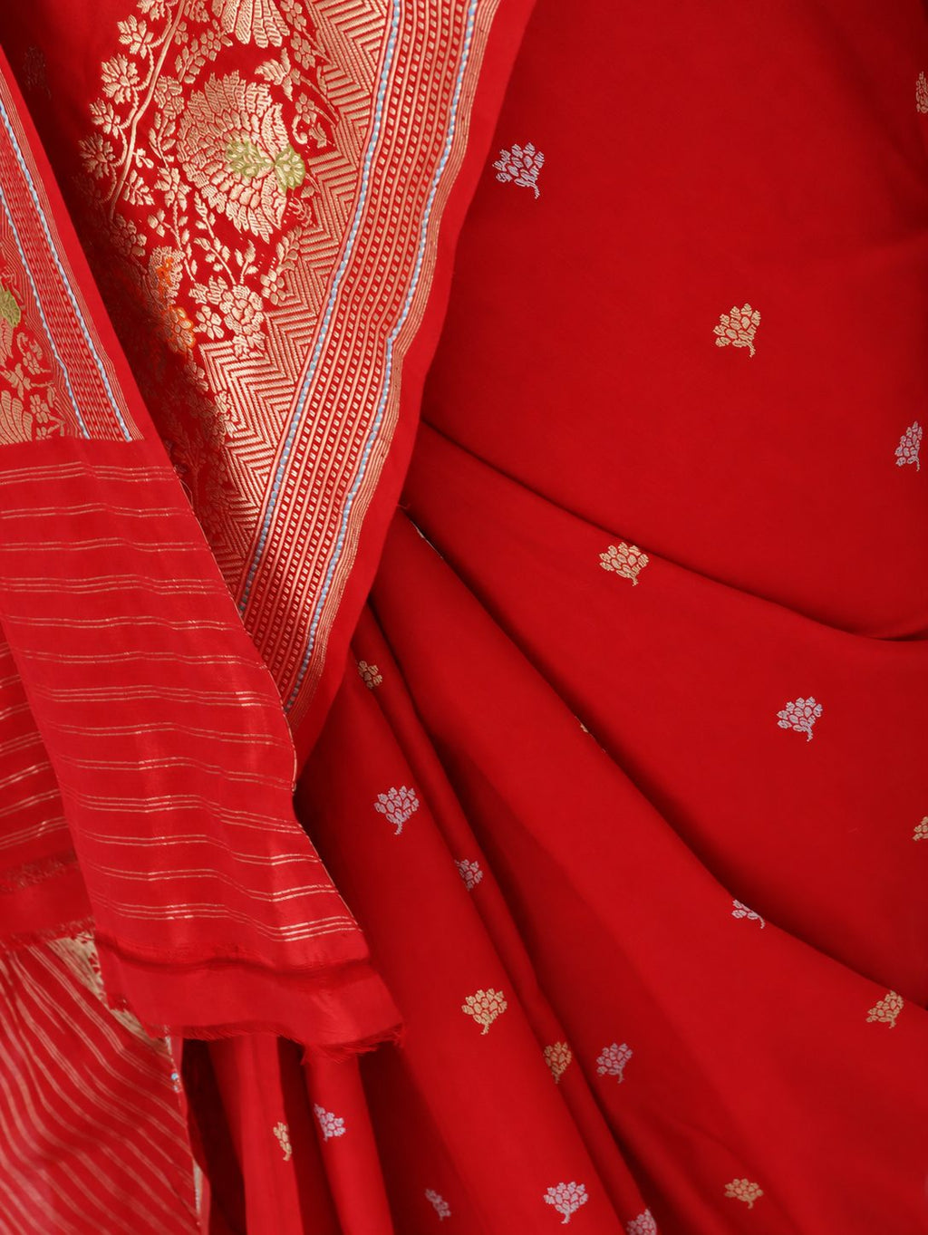 Rich vermilion red with gold and silver-toned zari, accented with green, purple and orange details Katan Silk Banarasi saree pallu detail