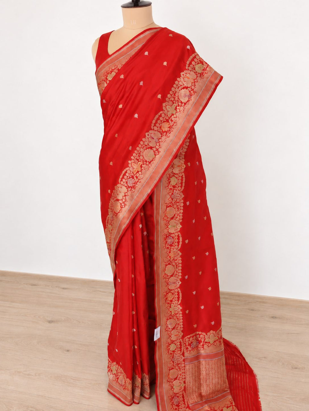 Rich vermilion red with gold and silver-toned zari, accented with green, purple and orange details Katan Silk Banarasi saree front drape view