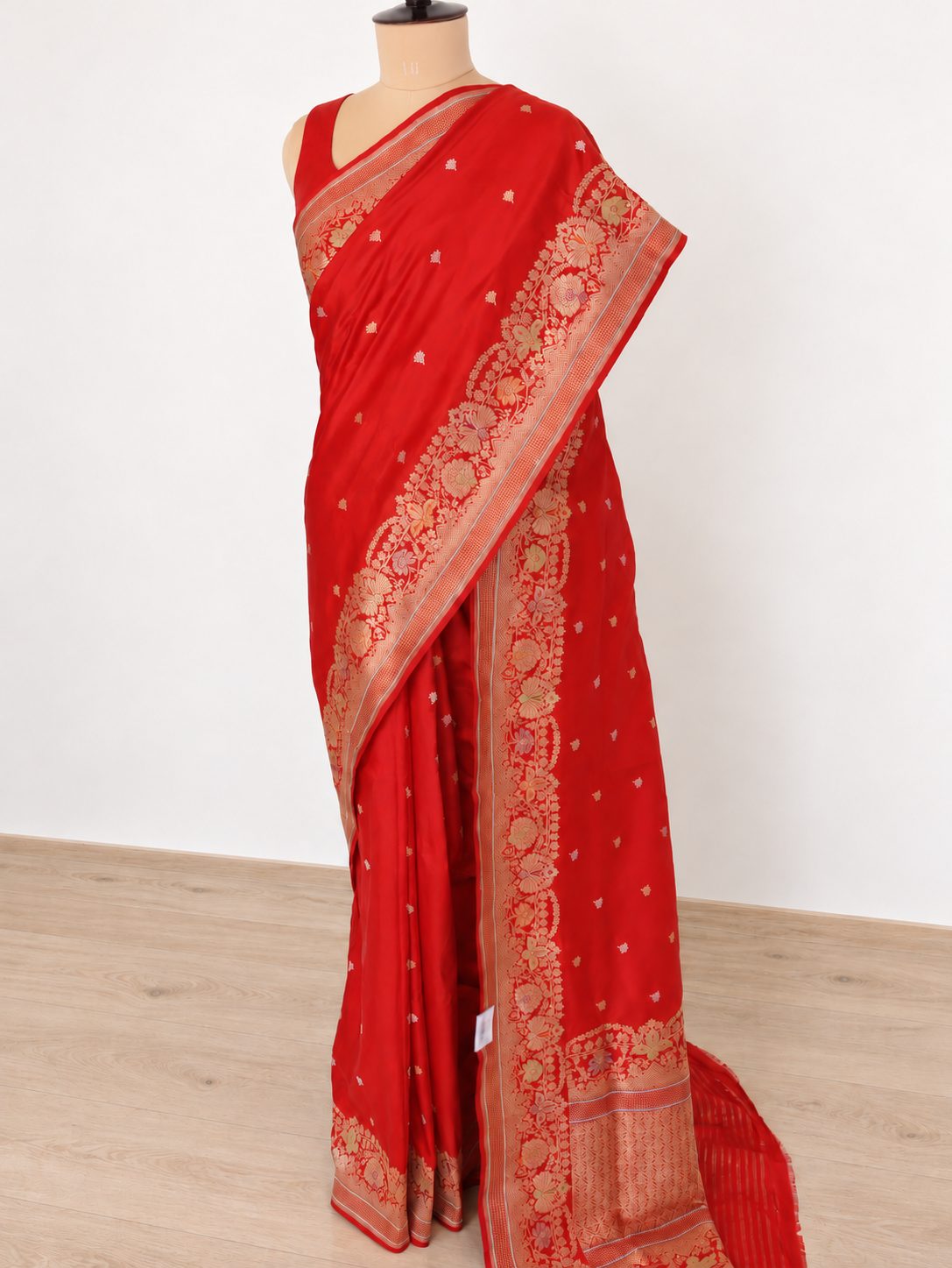 Rich vermilion red with gold and silver-toned zari, accented with green, purple and orange details Katan Silk Banarasi saree front drape view