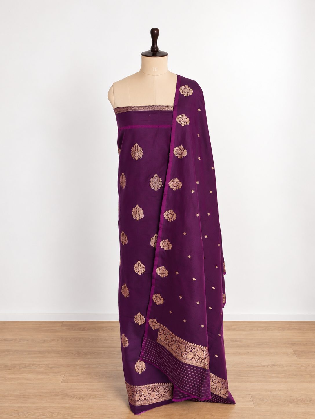 Rich plum purple with gold-toned zari detailing and subtle magenta edging Katan Silk Banarasi suit front drape view