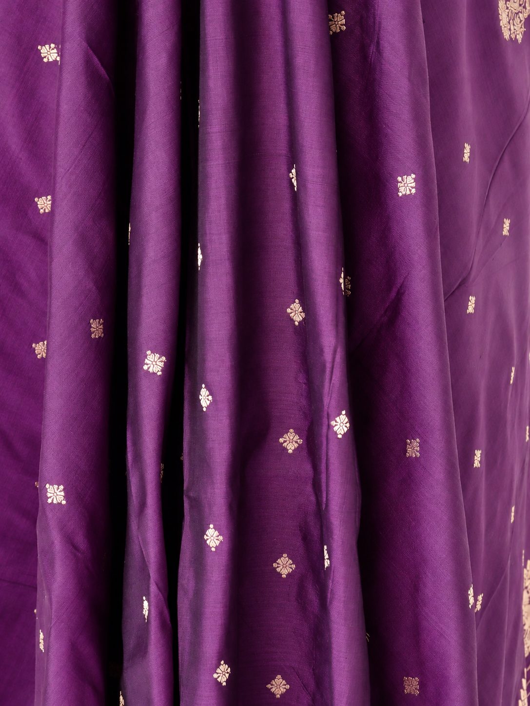 Rich plum purple with gold-toned zari detailing and subtle magenta edging Katan Silk Banarasi suit border closeup